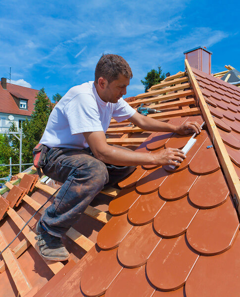 Damaged shingle roof repair close-up